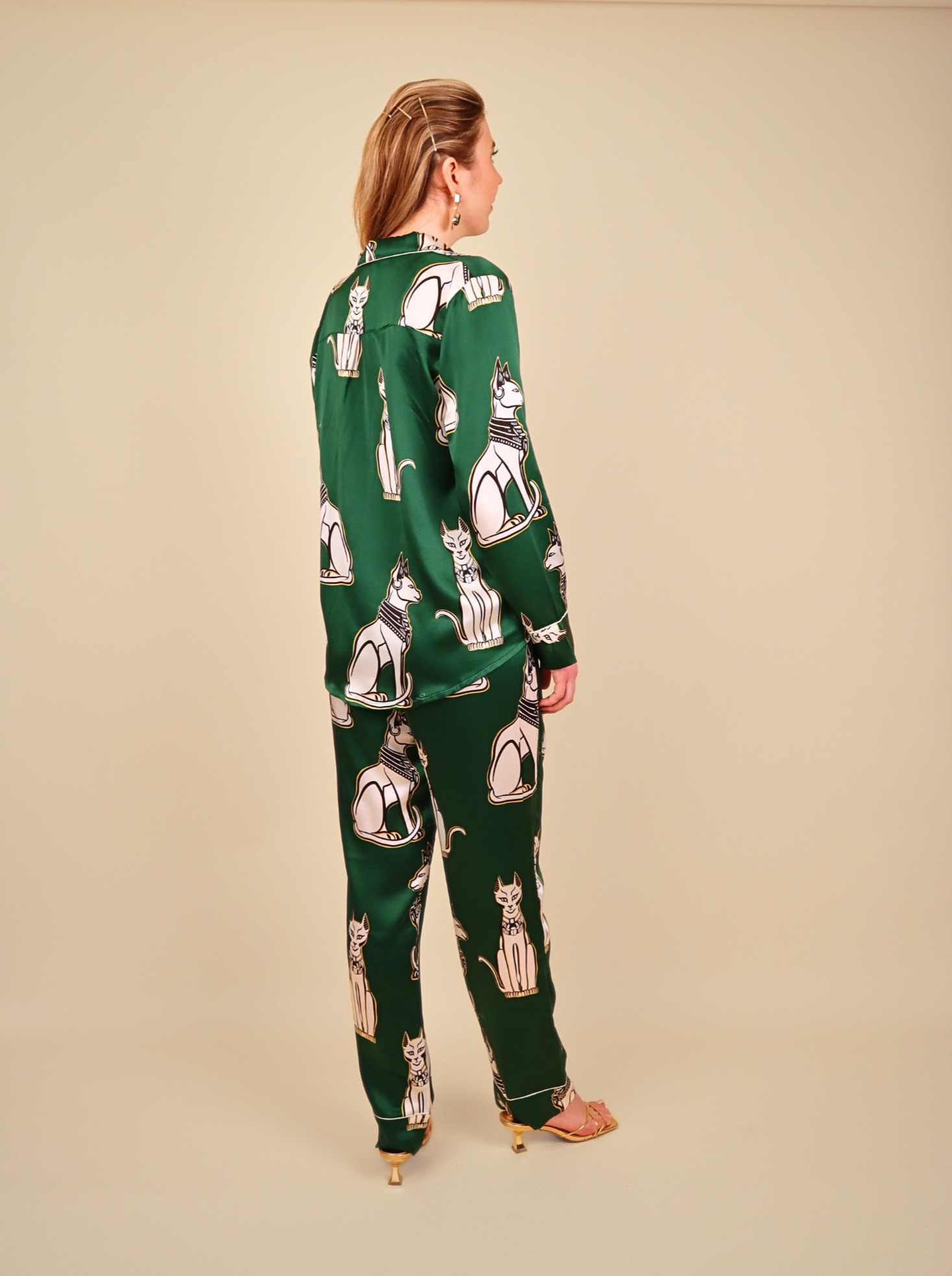 "Emerald green silk pajamas inspired by Bastet, the ancient Egyptian goddess